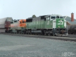 BNSF 9233 SD60M and BNSF 2125 GP38AC waiting for eastbound to pass